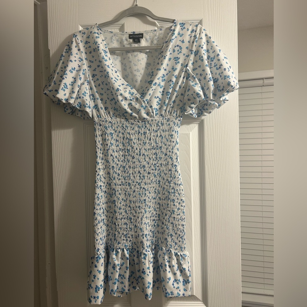 Pretty little thing blue floral body on dress.